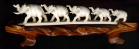 ivory-elephants-on-wood-restored