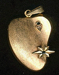 Pendant golden heart and diamond. 