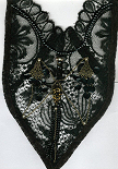 Old lace breast-plate restored and black pearls. 